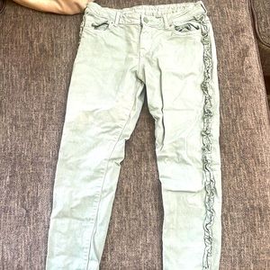 Green jeans with little green bows on side. I4 for girls